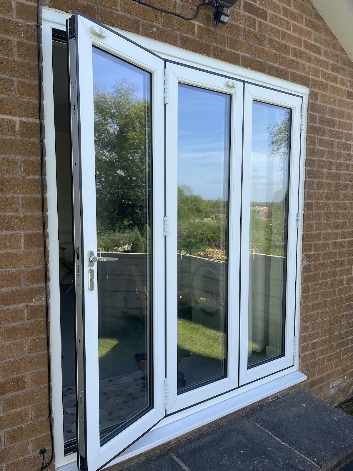 White uPVC bifold doors repaired in Manchester
