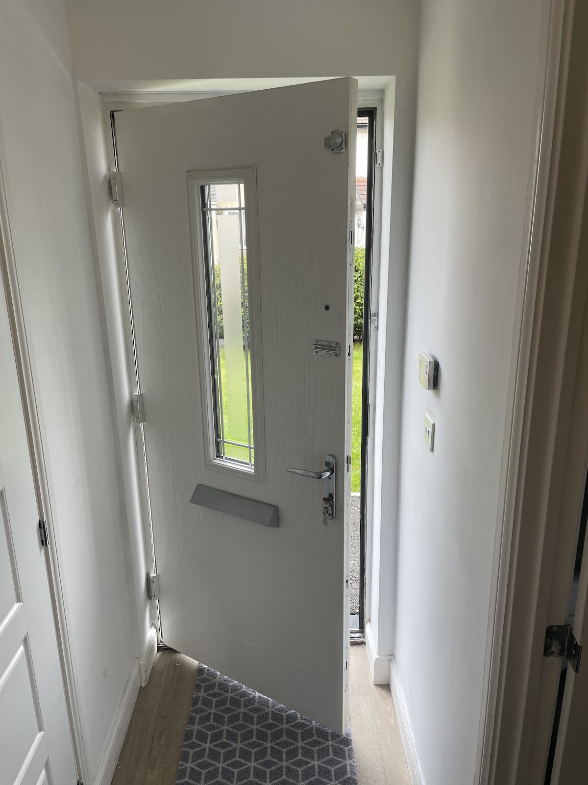 White composite front door with new handle fitted
